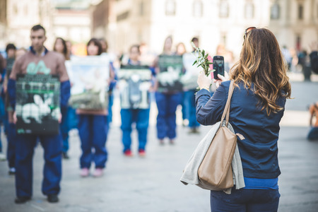 MILAN, ITALY - APRIL 13: Essere Animali protest on April, 13 2014: a group of activists of animal rights association 'Essere Animali' performed with real dead lambs in city center before easterのeditorial素材