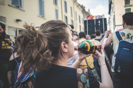 MILAN, ITALY - MAY 1: labor day held in Milan on May 1, 2014. Every year thousands of people taking to the streets to celebrate labor day and to protest against italian austerityのeditorial素材