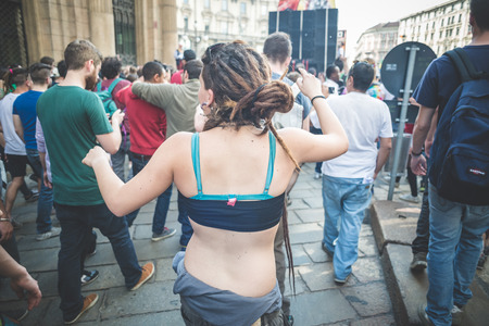 MILAN, ITALY - MAY 1: labor day held in Milan on May 1, 2014. Every year thousands of people taking to the streets to celebrate labor day and to protest against italian austerityのeditorial素材
