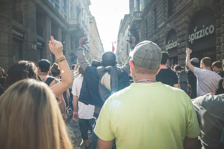MILAN, ITALY - MAY 1: labor day held in Milan on May 1, 2014. Every year thousands of people taking to the streets to celebrate labor day and to protest against italian austerityのeditorial素材