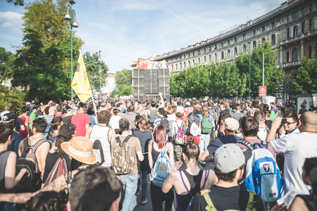 MILAN, ITALY - MAY 1: labor day held in Milan on May 1, 2014. Every year thousands of people taking to the streets to celebrate labor day and to protest against italian austerityのeditorial素材
