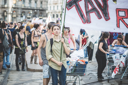 MILAN, ITALY - MAY 1: labor day held in Milan on May 1, 2014. Every year thousands of people taking to the streets to celebrate labor day and to protest against italian austerityのeditorial素材