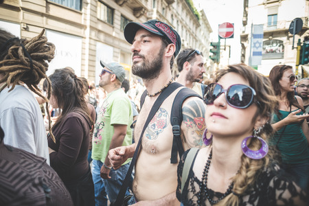 MILAN, ITALY - MAY 1: labor day held in Milan on May 1, 2014. Every year thousands of people taking to the streets to celebrate labor day and to protest against italian austerityのeditorial素材