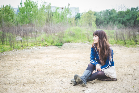 beautiful woman in a desolate lurban landscapeの写真素材