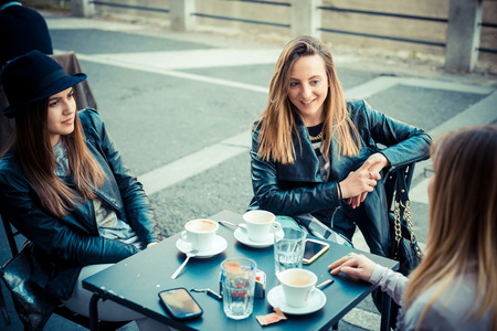 three beautiful friends authentic in urban contestの写真素材