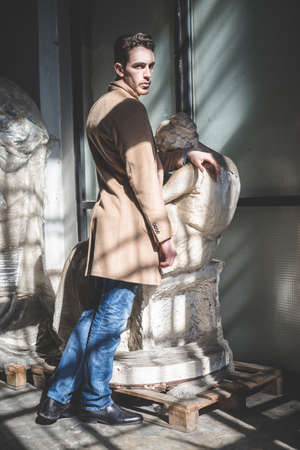 young handsome fashion model man outdoorsの写真素材
