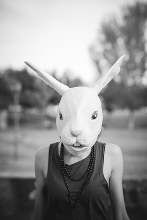rabbit mask young beautiful model woman in the cityの写真素材