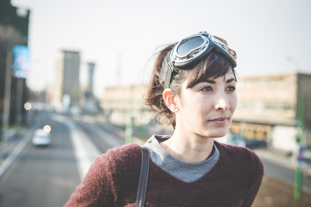 young beautiful hipster woman success aviator glasses  in the cityの写真素材