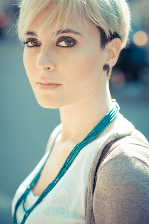 beautiful young blonde short hair hipster woman in the cityの写真素材