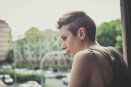 young lesbian stylish hair style woman at home の写真素材