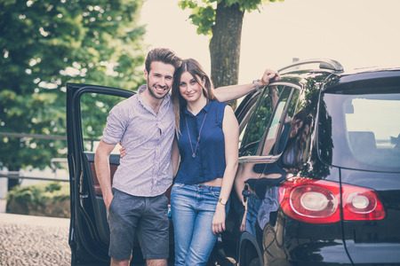 young beautiful couple lovers in the carの写真素材