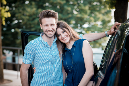 young beautiful couple lovers in the carの写真素材