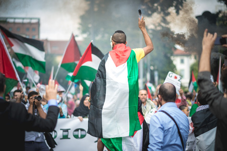 MILAN, ITALY - JULY 26: Pro Palestine manifestation held in Milan on July, 26 2014. People took to the streets to claim  Gaza and Palestine freedom against israel war and bombingのeditorial素材