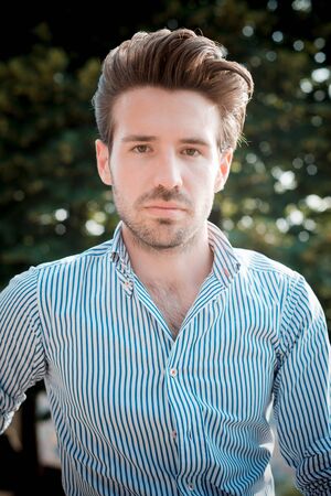 young handsome hipster modern man outdoor in summertime