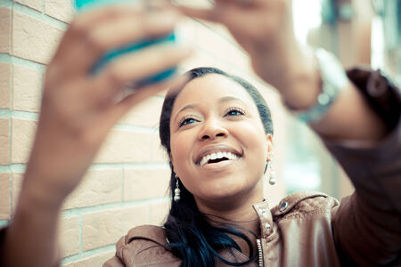 beautiful african young woman selfie in the city