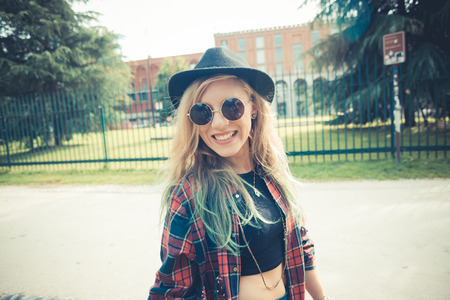 beautiful young blonde hair woman hipster in the city