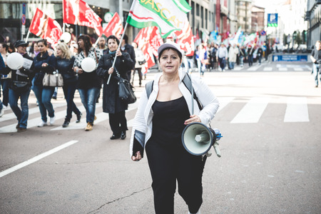 MILAN, ITALY - OCTOBER 31: National Strike of tourism in Milan on October, 31 2013. Thousands of tourism workers take the street to protest against layoffs and cutbacks in the tourismのeditorial素材