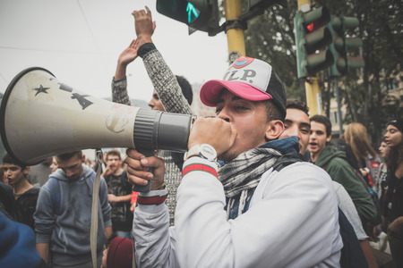 MILAN, ITALY - OCTOBER 10: Students manifestation held in Milan on October, 10 2014. Students took to the streets to protest against school italian reform and against milan expoのeditorial素材