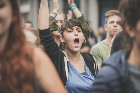 MILAN, ITALY - OCTOBER 10: Students manifestation held in Milan on October, 10 2014. Students took to the streets to protest against school italian reform and against milan expoのeditorial素材