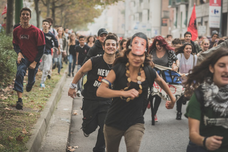 MILAN, ITALY - OCTOBER 10: Students manifestation held in Milan on October, 10 2014. Students took to the streets to protest against school italian reform and against milan expoのeditorial素材