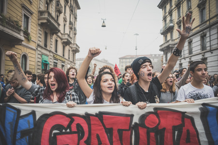 MILAN, ITALY - OCTOBER 10: Students manifestation held in Milan on October, 10 2014. Students took to the streets to protest against school italian reform and against milan expoのeditorial素材