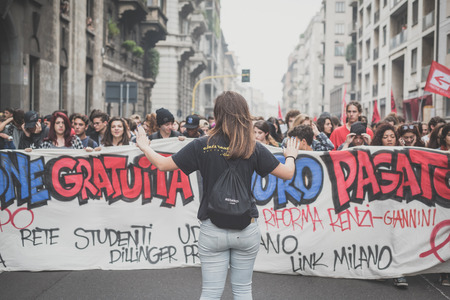 MILAN, ITALY - OCTOBER 10: Students manifestation held in Milan on October, 10 2014. Students took to the streets to protest against school italian reform and against milan expoのeditorial素材