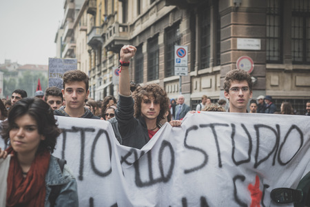 MILAN, ITALY - OCTOBER 10: Students manifestation held in Milan on October, 10 2014. Students took to the streets to protest against school italian reform and against milan expoのeditorial素材