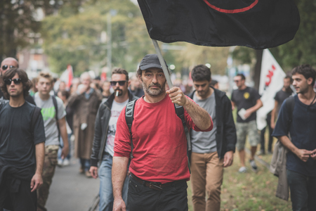 MILAN, ITALY - OCTOBER 11: demonstration held in Milan october 11, 2014. People took streets to protest against Milan expo to be held in 2015, event important worldwide.のeditorial素材