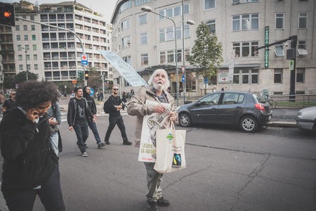MILAN, ITALY - OCTOBER 11: demonstration held in Milan october 11, 2014. People took streets to protest against Milan expo to be held in 2015, event important worldwide.のeditorial素材