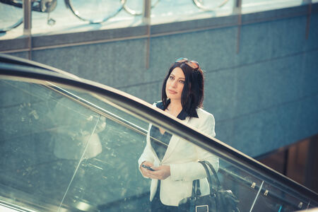 beautiful long black hair elegant business woman in the city