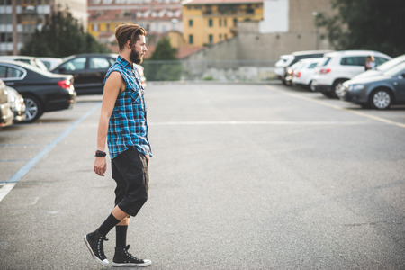young handsome bearded hipster man in the cityの写真素材