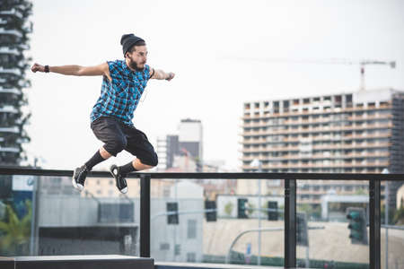 young handsome bearded hipster man in the cityの写真素材