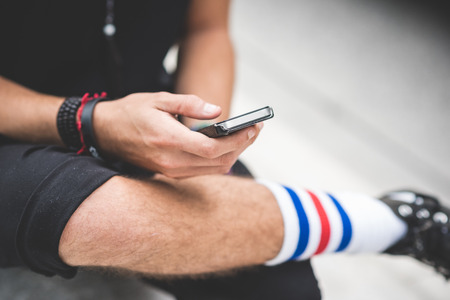 close up of hands guy using smartphone in the cityの写真素材