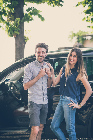 young beautiful couple lovers in the carの写真素材