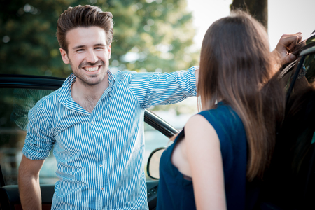 young beautiful couple lovers in the carの写真素材