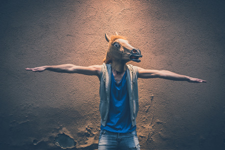 horse mask young hipster man in the city