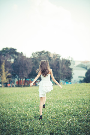 beautiful young woman with white dressの写真素材