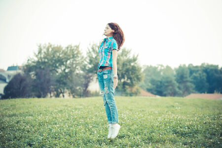 beautiful young hipster woman jumping