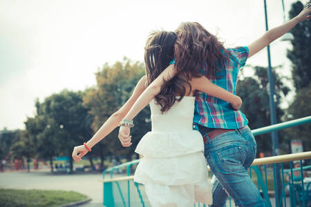 beautiful hipster young women sisters friends in the cityの写真素材