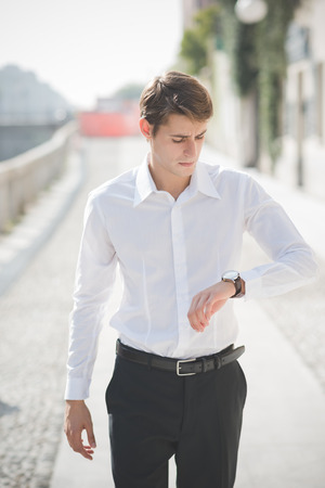 young handsome elegant blonde model man in the cityの写真素材