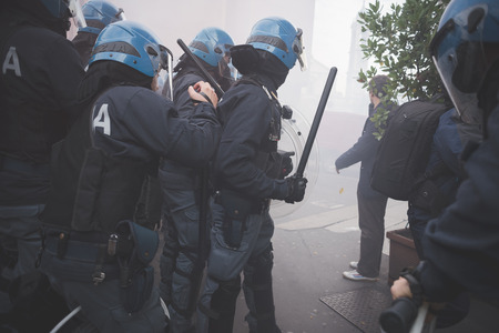MILAN, ITALY - NOVEMBER 14: Student demonstration held in Milan November 14, 2014. police fighting...