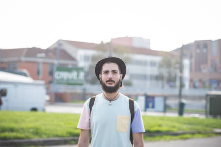 young handsome hipster gay modern man in townの写真素材