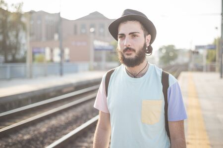 young handsome hipster gay modern man in town