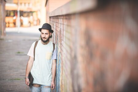 young handsome hipster gay modern man in town