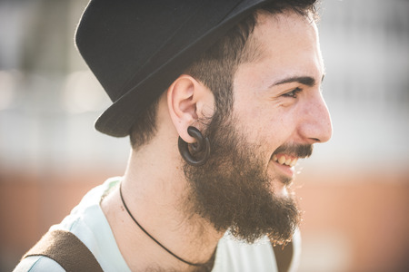 young handsome hipster gay modern man in townの写真素材
