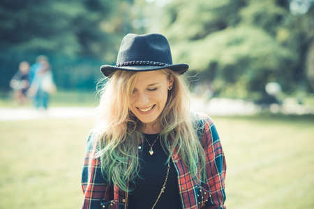 beautiful young blonde hair woman hipster in the cityの写真素材