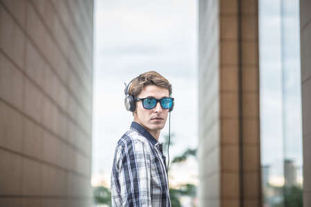 young model hansome blonde man in the cityの写真素材