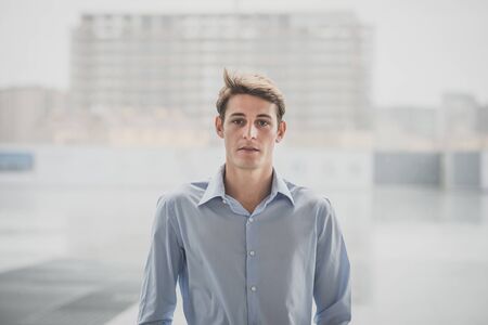 young model hansome blonde man in the cityの写真素材