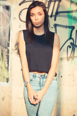 young beautiful brunette straight hair woman outdoorの写真素材