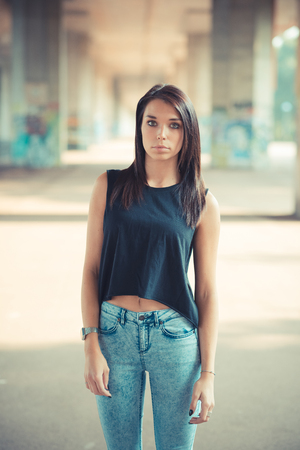 young beautiful brunette straight hair woman outdoorの写真素材